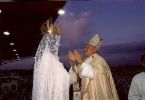 Pope John Paul II prays before the image of Our Lady of Fatima, for the needs of the world. The assasin's bullet which almost claimed his life is now set in her crown, as he attributed his recovery to her intercession